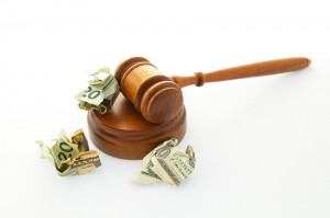 court legal gavel with crumpled cash